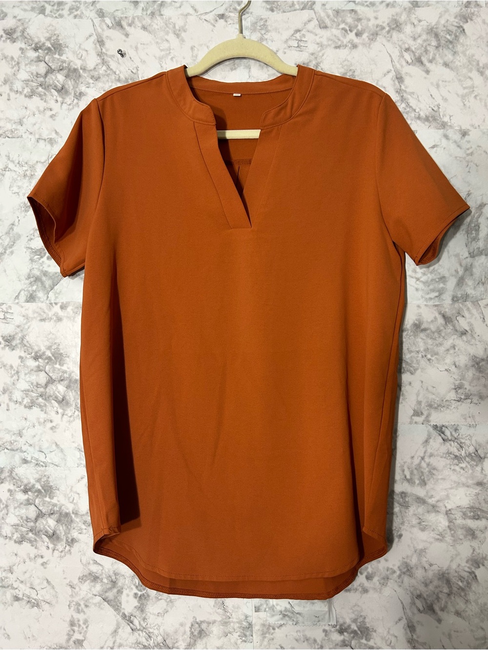 Women’s Split Neck Short Sleeve Tee in Rust Orange.  55